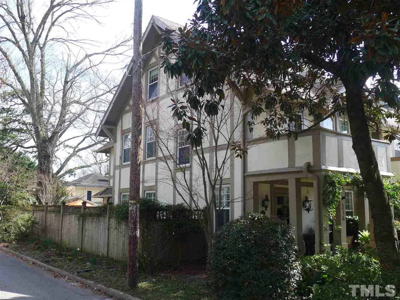 136 Woodburn Road, Unit 4 Raleigh, NC 27605 - Photo 3 of 18 a front view of a house with a yard and trees