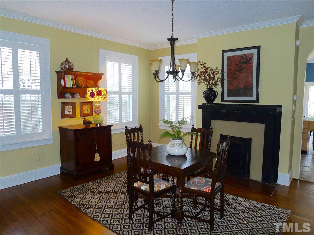 136 Woodburn Road, Unit 4 Raleigh, NC 27605 - Photo 6 of 18 a view of a dining room with furniture window and wooden floor