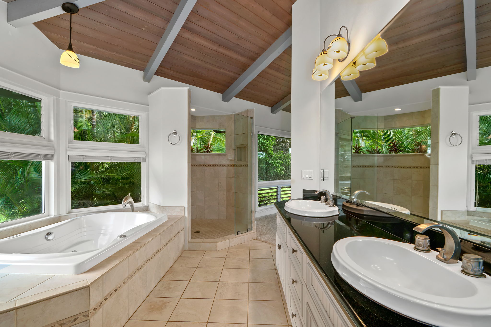 4928 Wailapa Road, Unit A Kilauea, HI 96754 - Photo 13 of 30 a bathroom with a granite countertop sink and large mirror