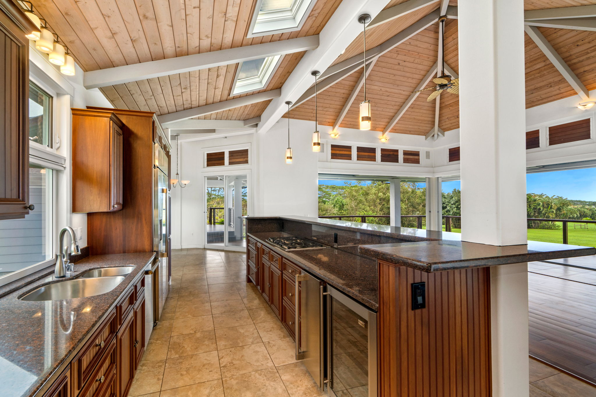 4928 Wailapa Road, Unit A Kilauea, HI 96754 - Photo 19 of 30 a kitchen with counter top space and stainless steel appliances