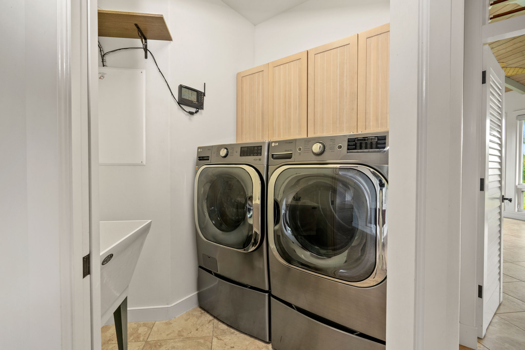 4928 Wailapa Road, Unit A Kilauea, HI 96754 - Photo 25 of 30 a utility room with dryer and washer