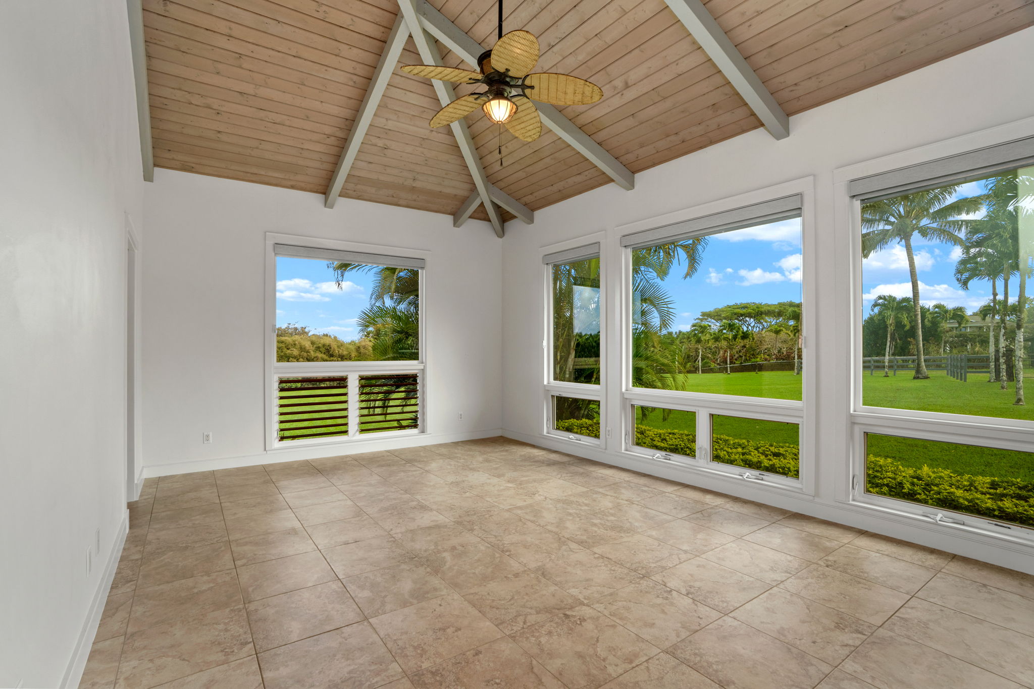 4928 Wailapa Road, Unit A Kilauea, HI 96754 - Photo 26 of 30 a view of an empty room with a window and ceiling fan