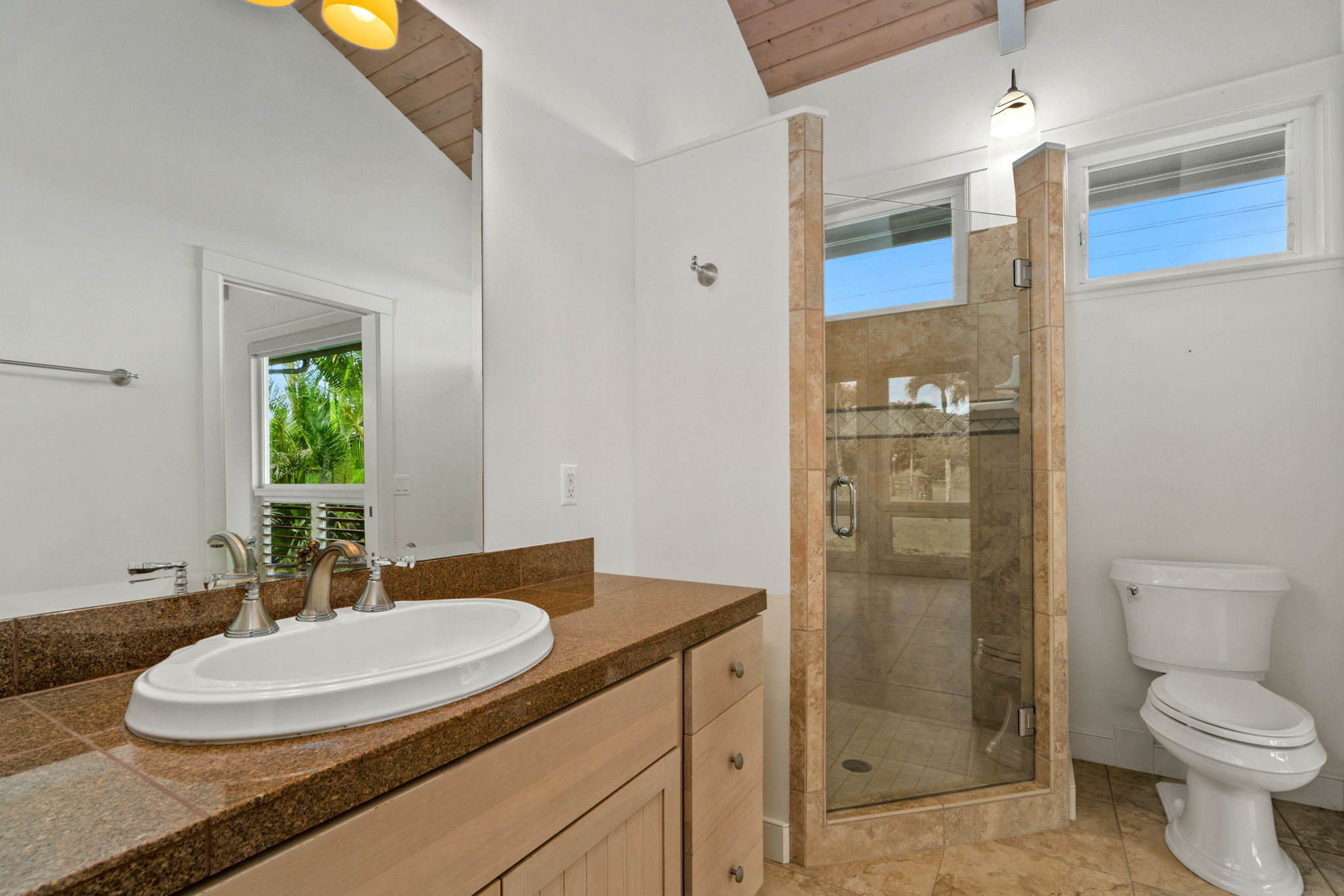 4928 Wailapa Road, Unit A Kilauea, HI 96754 - Photo 29 of 30 a bathroom with a granite countertop sink toilet and shower