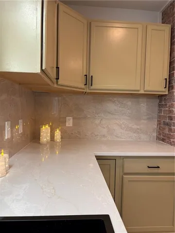 a kitchen with a sink and cabinets