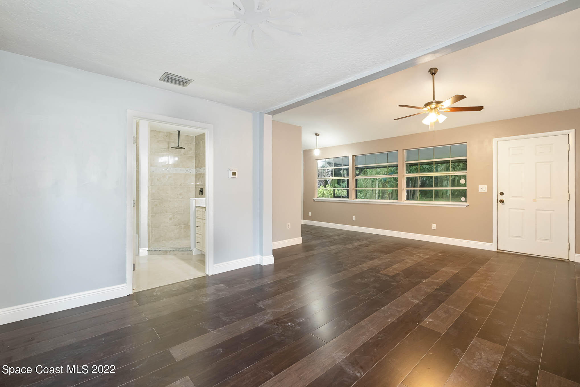 395 East Hall Road Merritt Island, FL 32953 - Photo 32 of 46 wooden floor in an empty room with a window