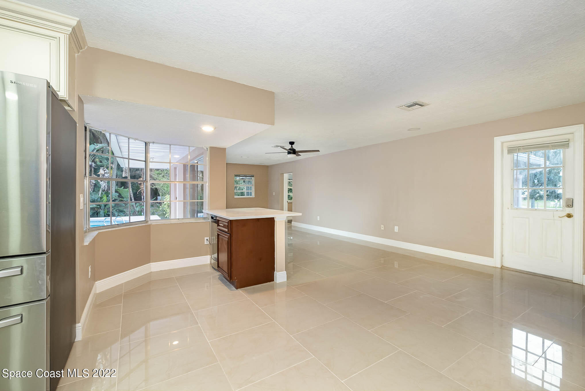 395 East Hall Road Merritt Island, FL 32953 - Photo 37 of 46 a view of kitchen with furniture and large window