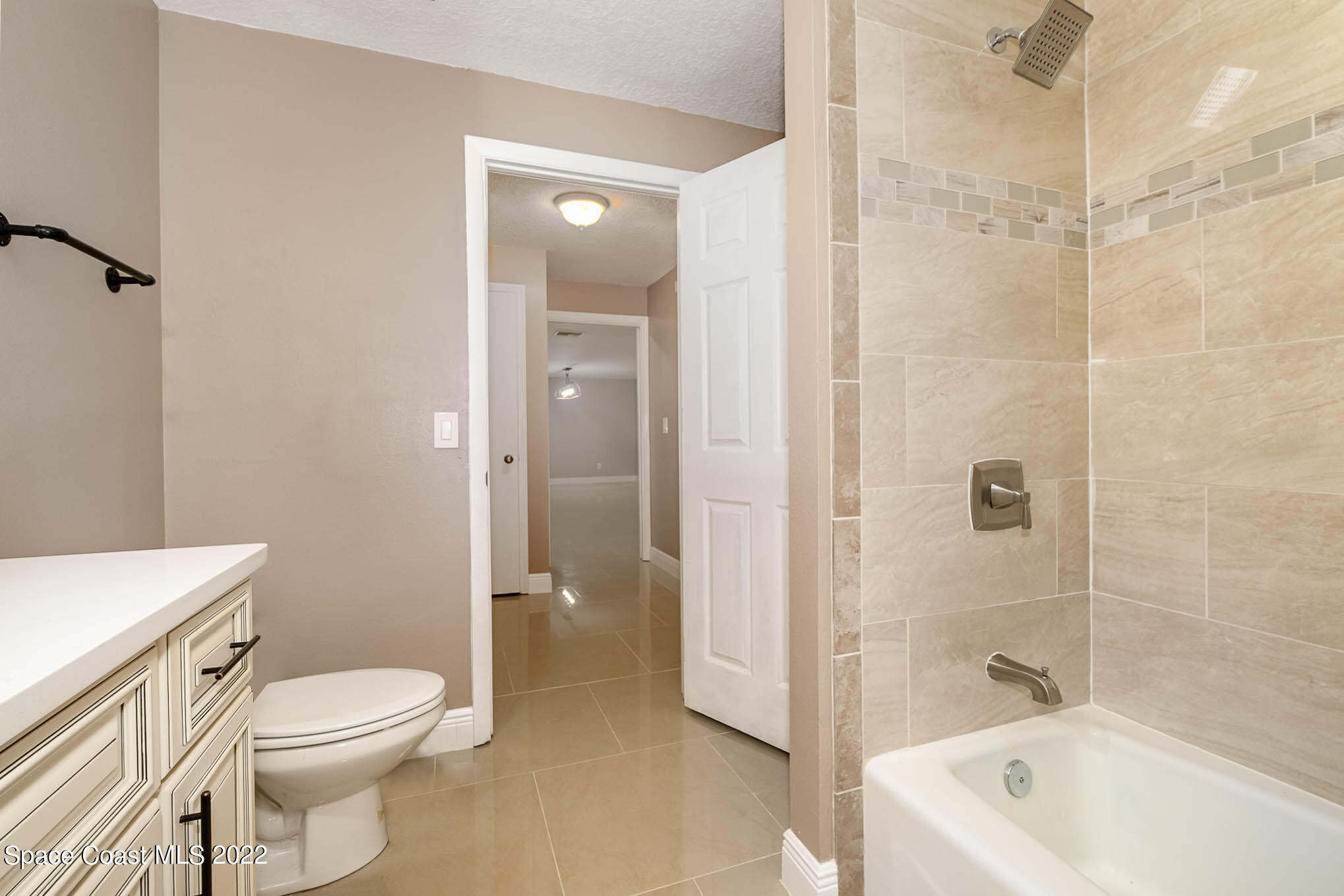 395 East Hall Road Merritt Island, FL 32953 - Photo 41 of 46 a bathroom with a toilet a sink and shower