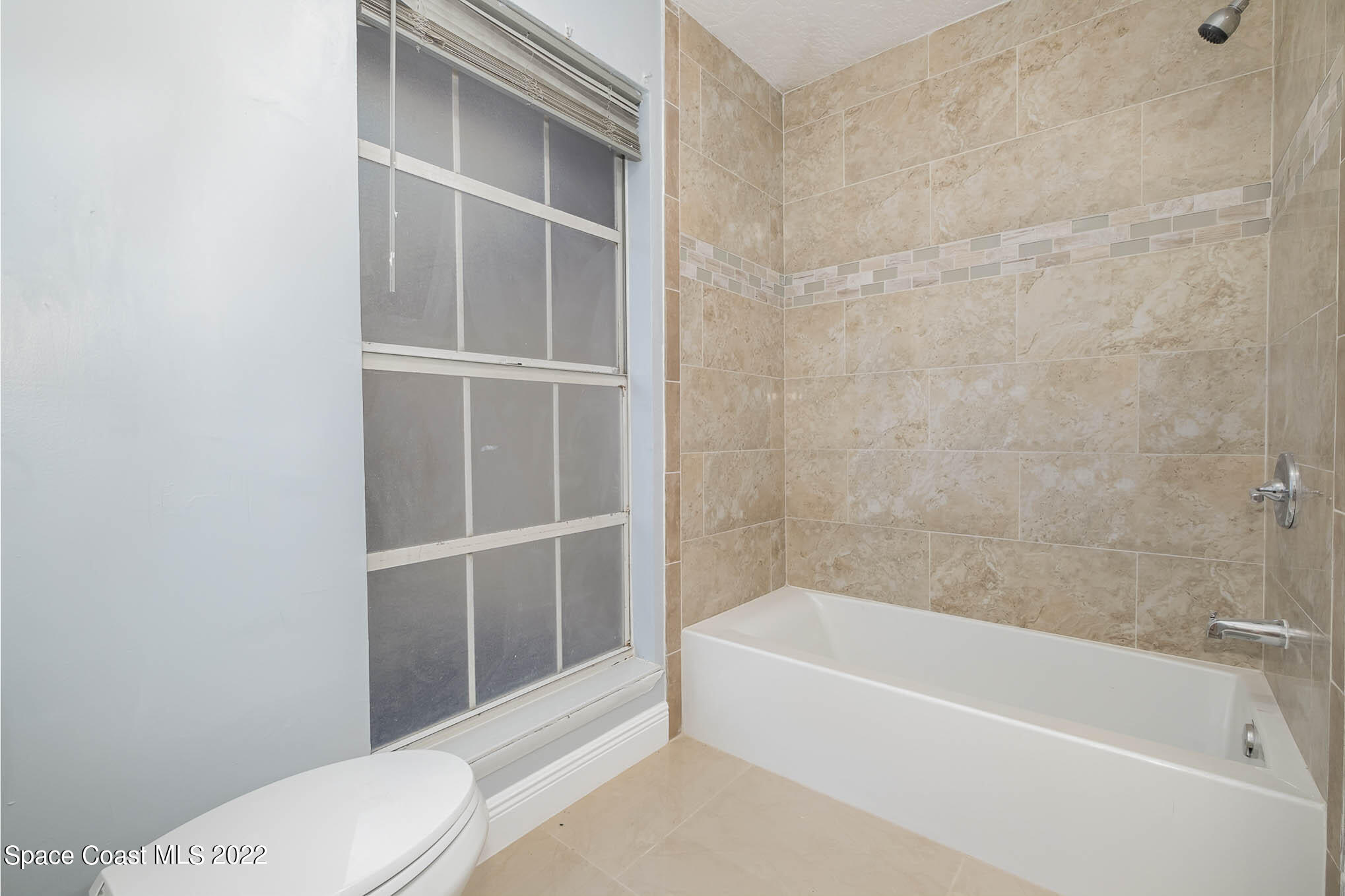 395 East Hall Road Merritt Island, FL 32953 - Photo 42 of 46 a bathroom with a bathtub and a toilet
