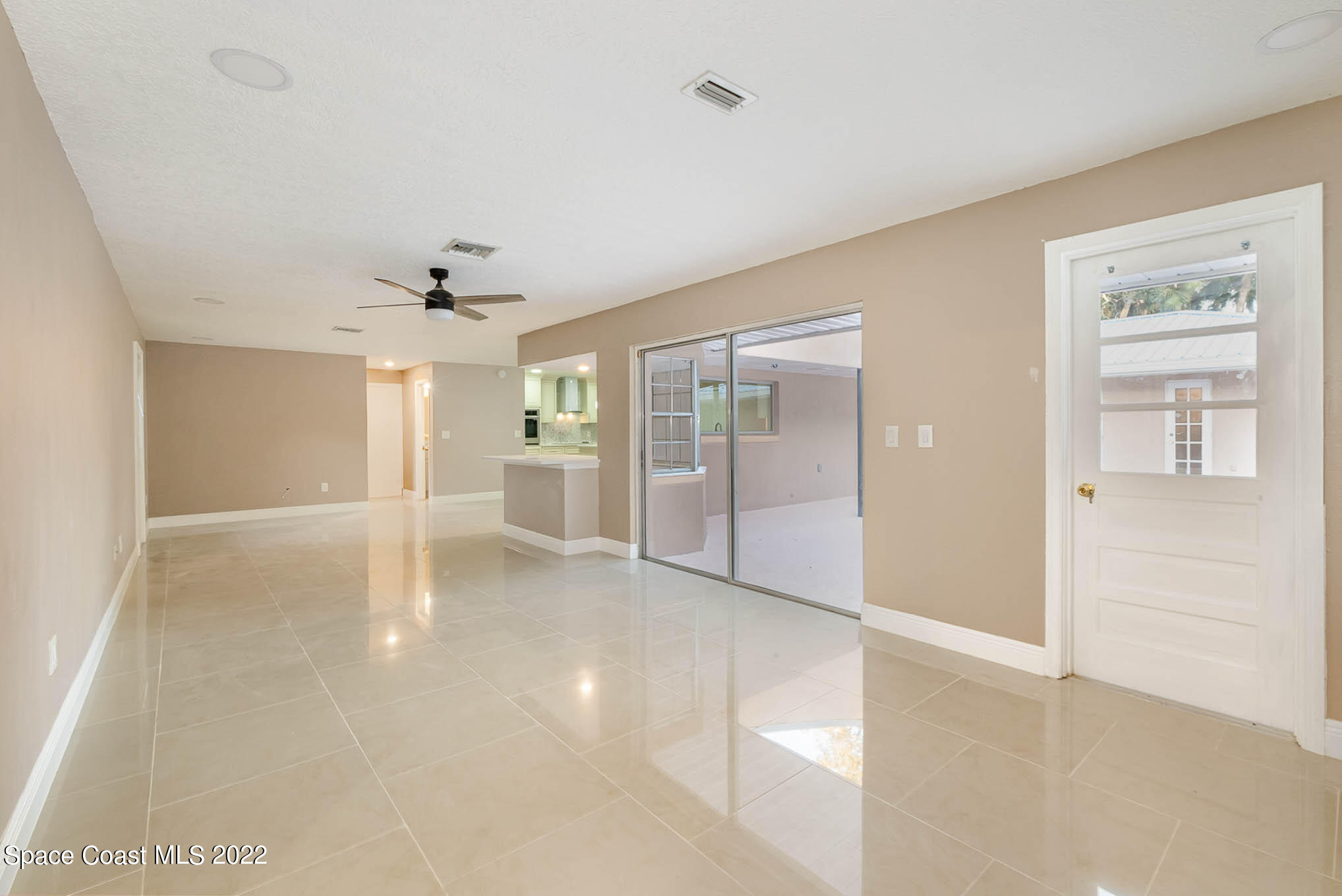 395 East Hall Road Merritt Island, FL 32953 - Photo 43 of 46 wooden floor in an empty room with a window