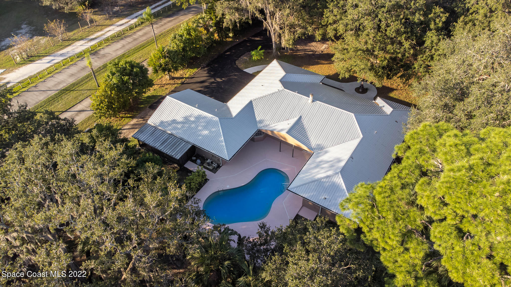 395 East Hall Road Merritt Island, FL 32953 - Photo 8 of 46 an aerial view of residential houses with outdoor space
