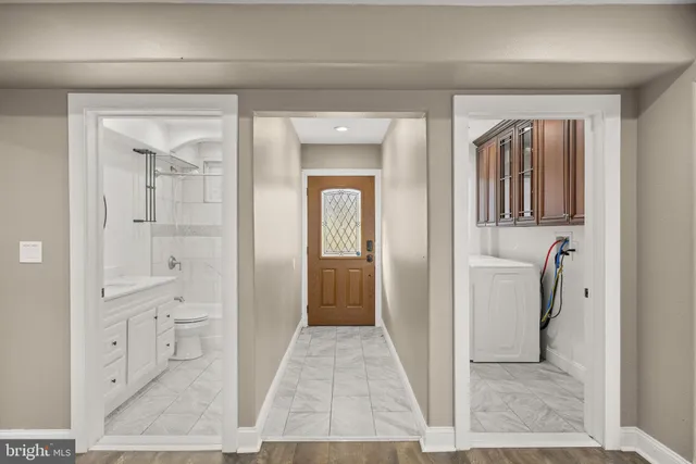 a view of a bathroom from a hallway