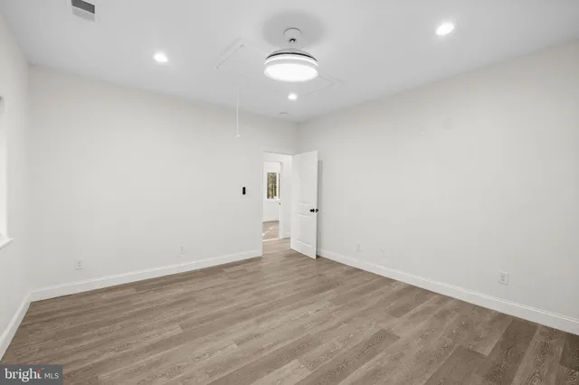 a bathroom with a granite countertop toilet a sink and bathtub