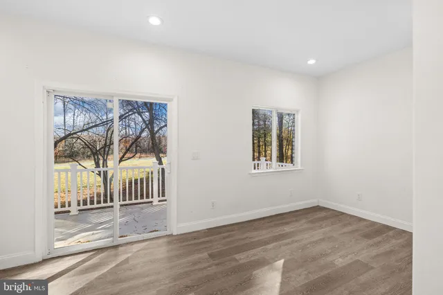 a view of entryway with wooden floor