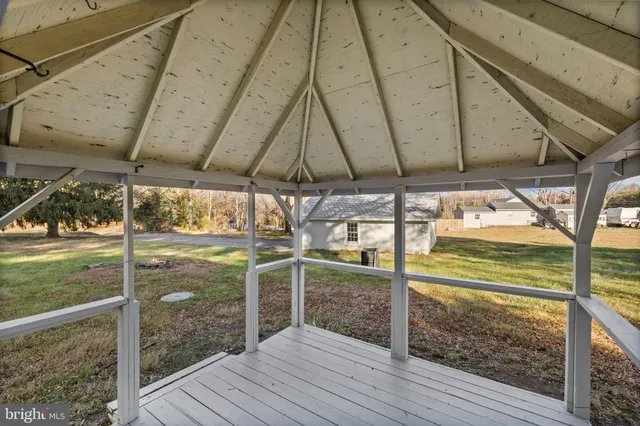 a front view of a house with a yard table and chairs