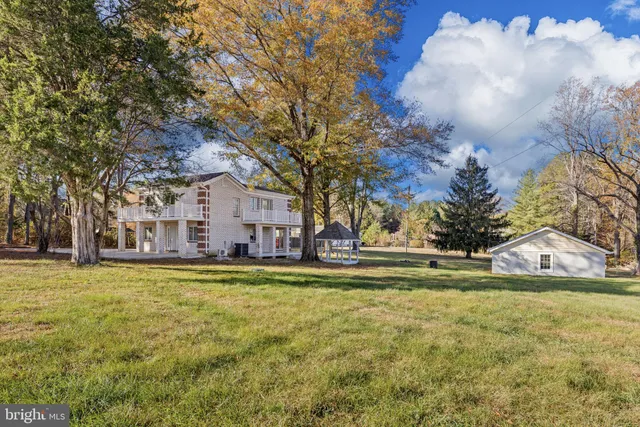 a view of a house with a big yard