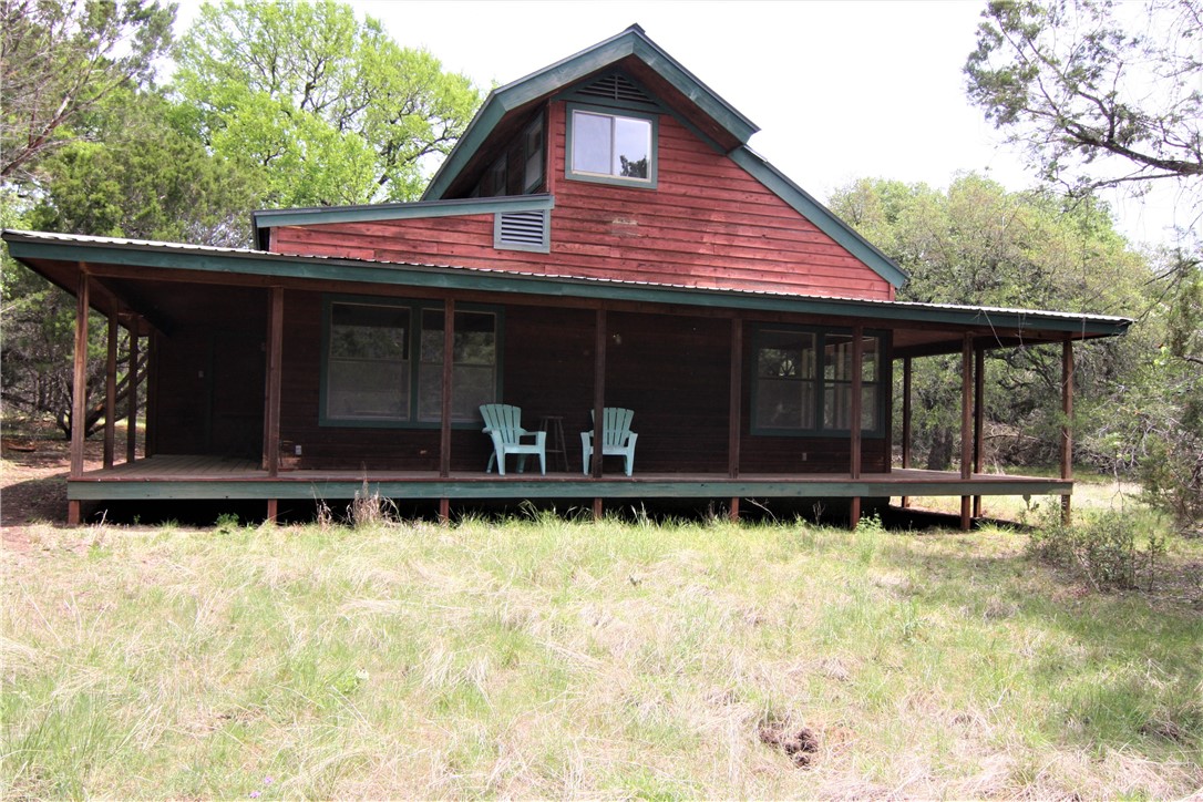 1551 Springlake Drive Dripping Springs, TX 78620 - Photo 1 of 1 a front view of a house with a yard