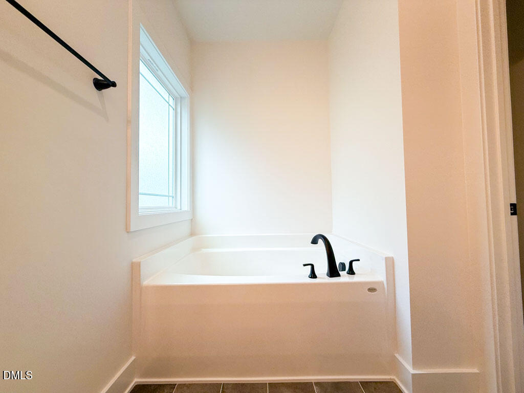 27 Decatur Drive Fuquay-Varina, NC 27526 - Photo 22 of 46 a bathroom with a bathtub