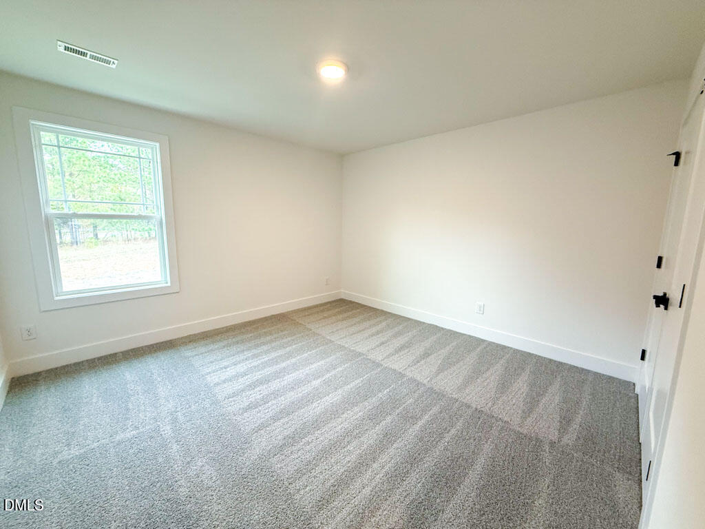 27 Decatur Drive Fuquay-Varina, NC 27526 - Photo 28 of 46 an empty room with a window