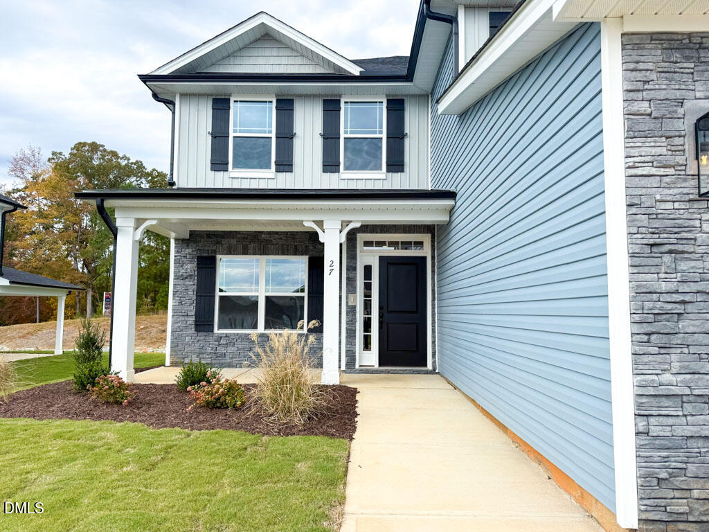 27 Decatur Drive Fuquay-Varina, NC 27526 - Photo 3 of 46 a front view of a house with garden