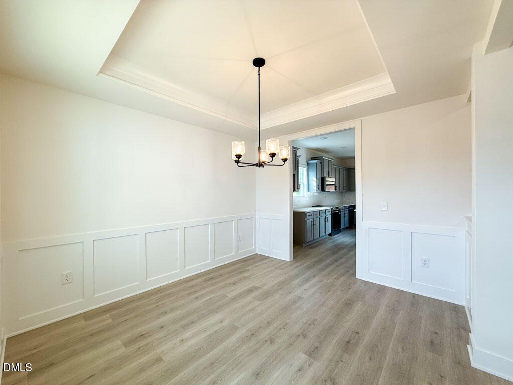 27 Decatur Drive Fuquay-Varina, NC 27526 - Photo 8 of 46 a view of a kitchen with a sink and dishwasher wooden floor