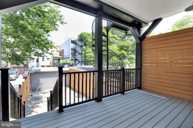 a view of a balcony with wooden floor