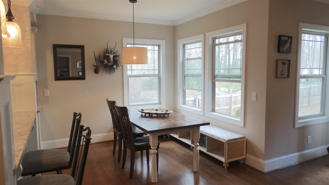 1308 Trinity Circle Raleigh, NC 27607 - Photo 6 of 25 Inviting Breakfast Room with a Banquette w/Storage below. Bright, Cheerful, and open to Kitchen and Family Room Breakfast Room