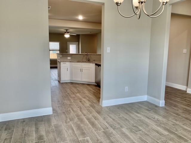 4404 Thalia Way Forney, TX 75126 - Photo 3 of 20 a view of a bathroom with a sink and mirror