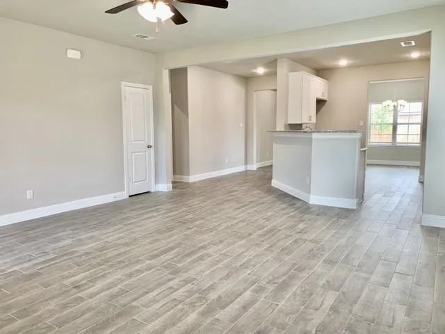 a view of kitchen with wooden floor