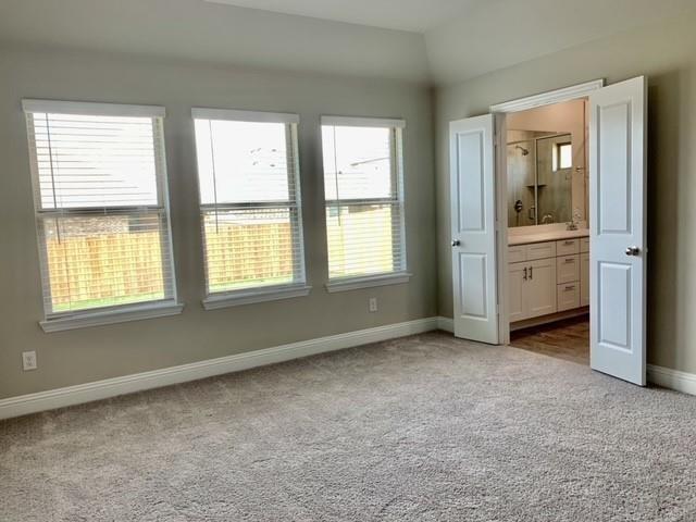 4404 Thalia Way Forney, TX 75126 - Photo 10 of 20 a view of an empty room with window and cabinet
