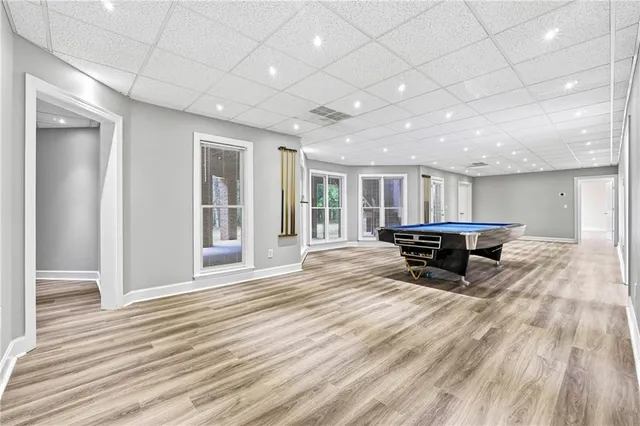 a bathroom with a toilet a sink and a mirror