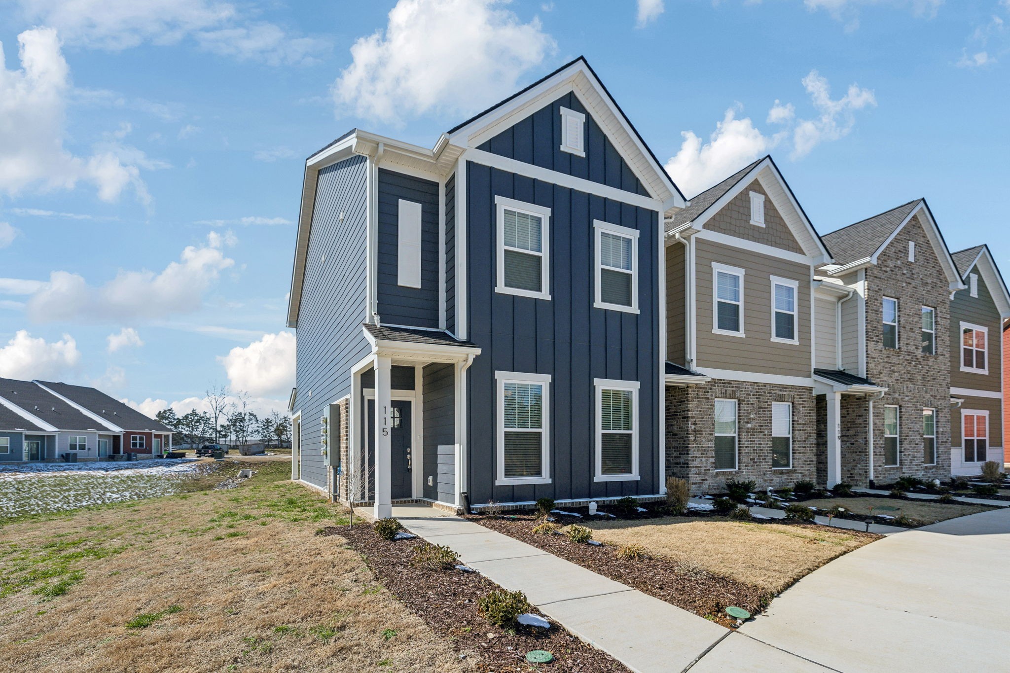 a view of a big house with a street