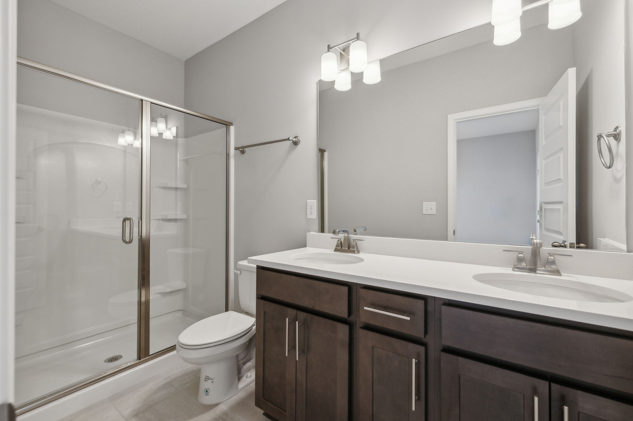 Undisclosed Address Lebanon, TN 37087 - Photo 11 of 13 a bathroom with a sink a toilet a mirror and shower