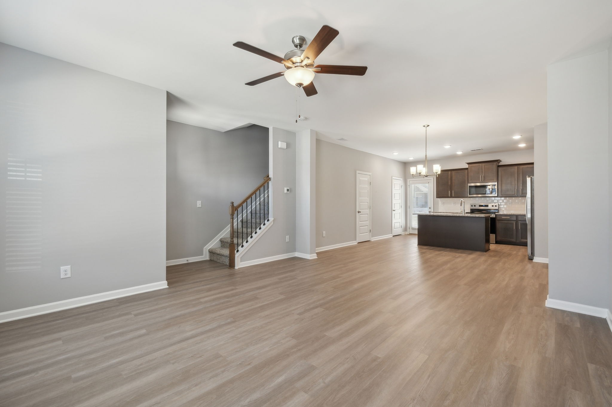 Undisclosed Address Lebanon, TN 37087 - Photo 6 of 13 a view of empty room with wooden floor and ceiling fan