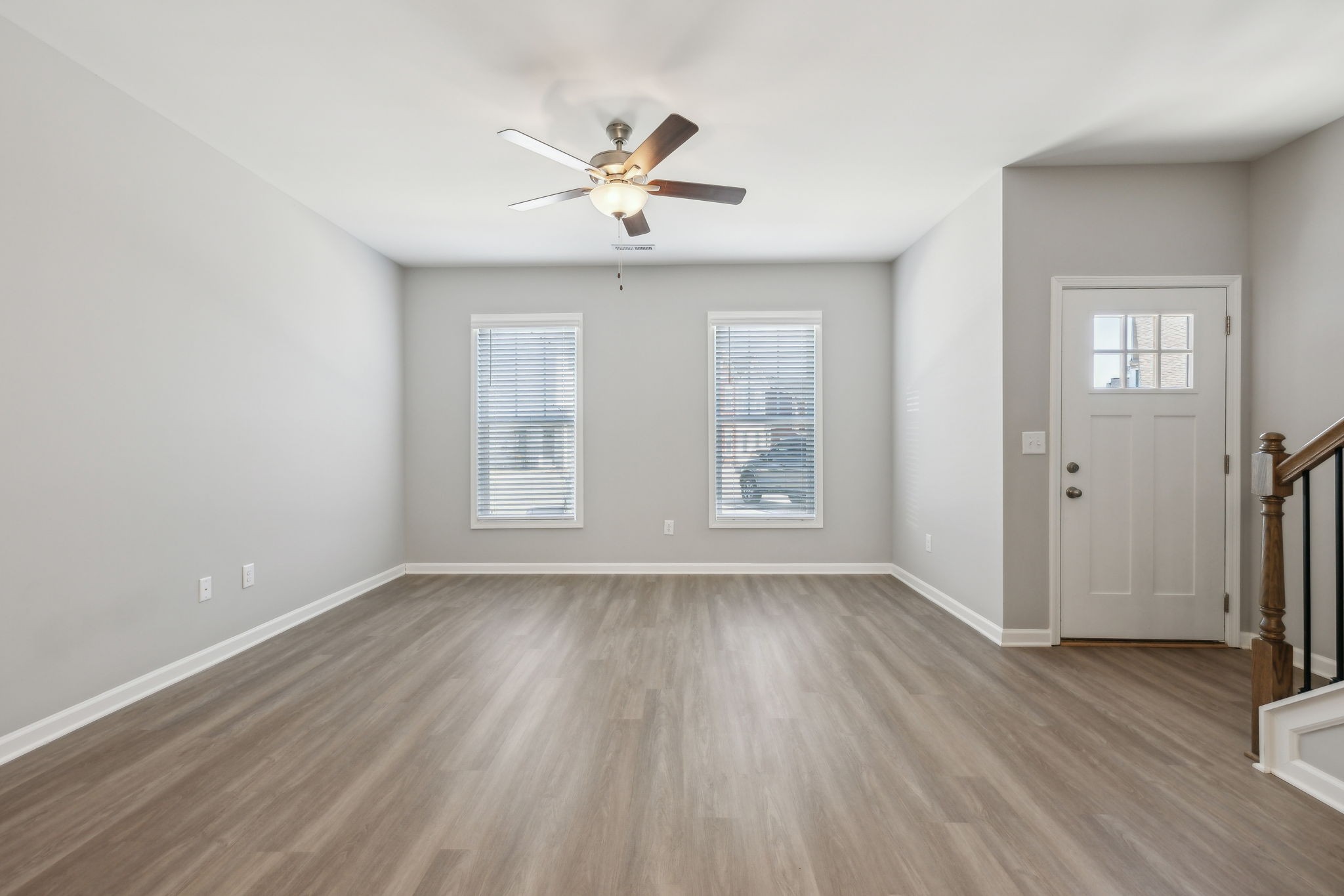 Undisclosed Address Lebanon, TN 37087 - Photo 7 of 13 an empty room with wooden floor chandelier fan and windows