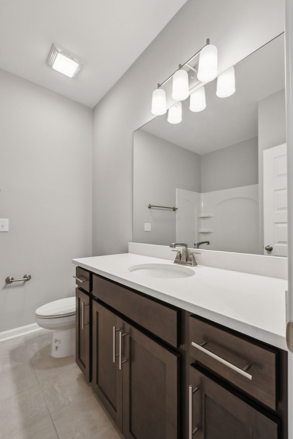 Undisclosed Address Lebanon, TN 37087 - Photo 10 of 13 a bathroom with a sink a toilet and a mirror