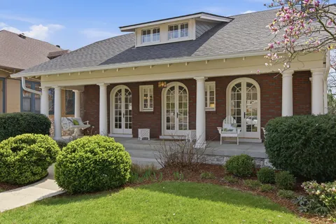 a front view of a house with garden