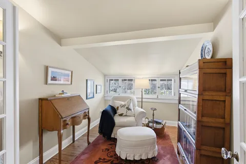 a living room with furniture and a lamp