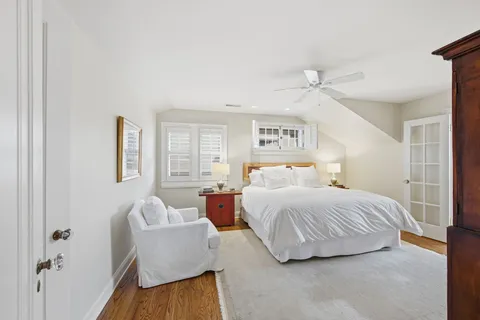 a bedroom with bed and window