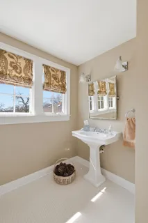 a kitchen with a sink cabinets and window