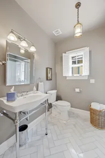 a room with a chandelier furniture and window