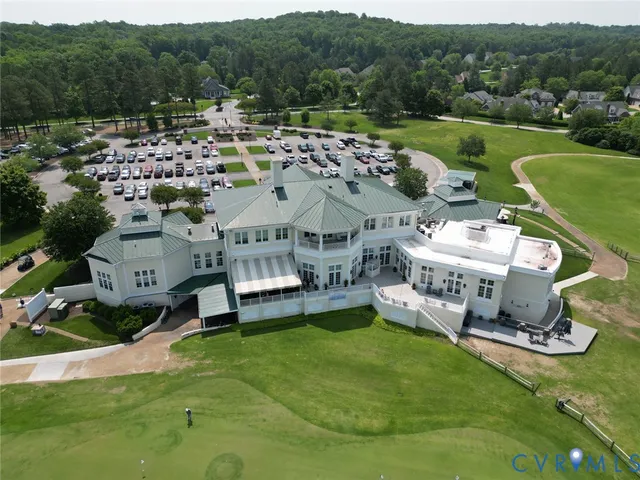 an aerial view of a house with outdoor space