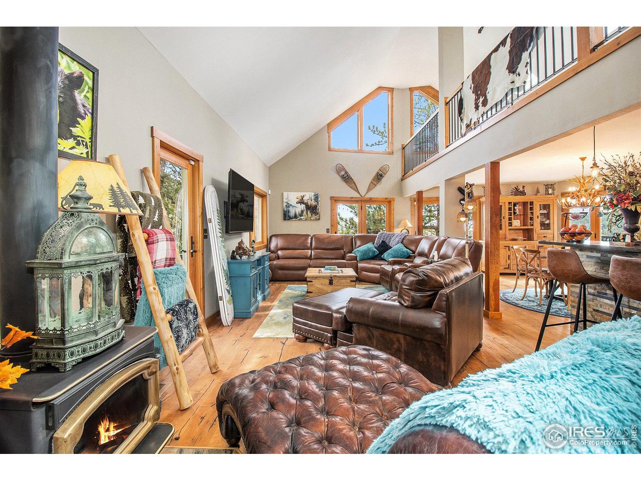 270 Choctaw Road Lyons, CO 80540 - Photo 11 of 30 Cozy Fireplace and Large Windows.