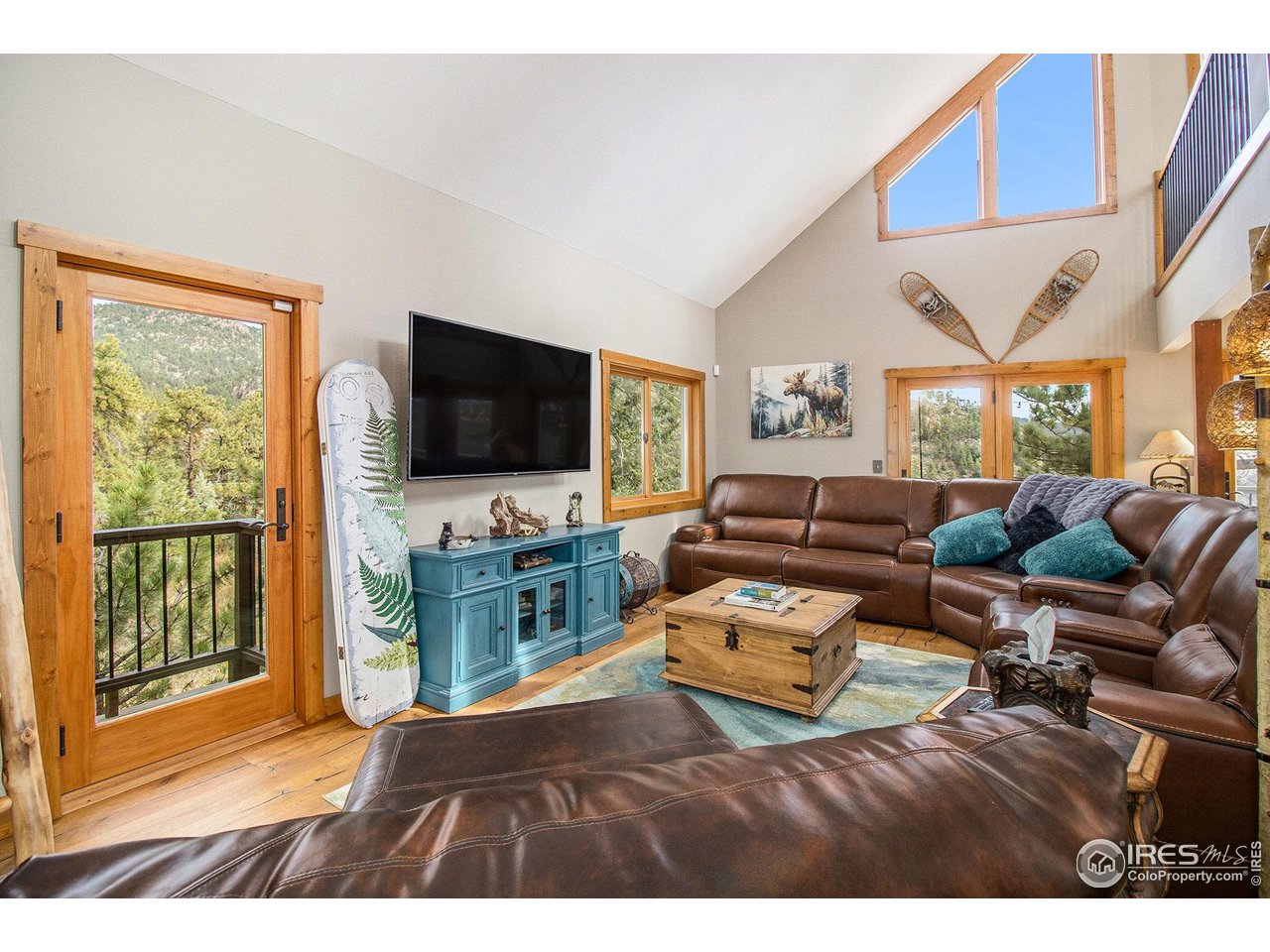 270 Choctaw Road Lyons, CO 80540 - Photo 12 of 30 Front door of the home leading into the main level living area.