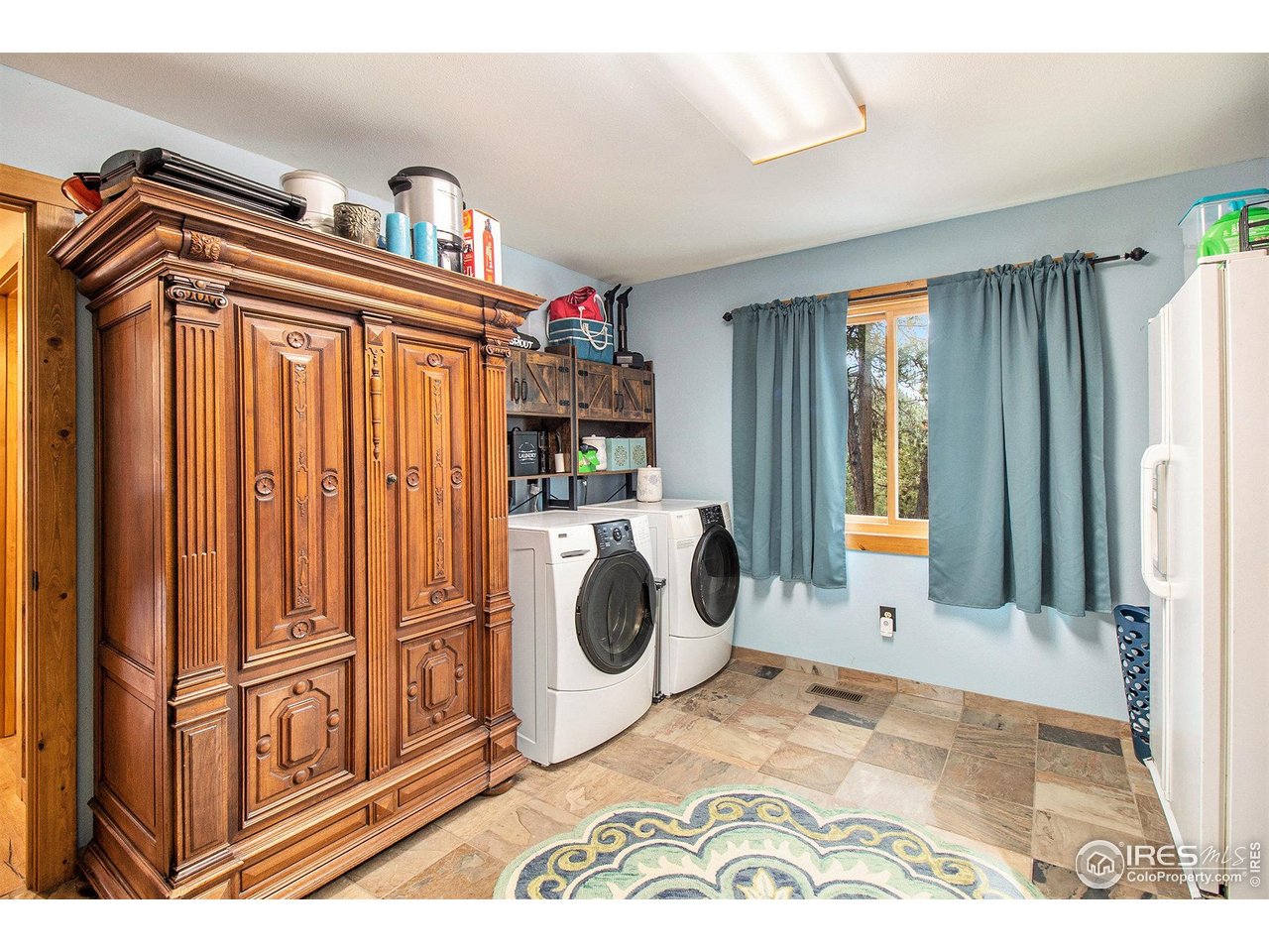 270 Choctaw Road Lyons, CO 80540 - Photo 20 of 30 Main Level Laundry and Storage with a 2nd entrance into the home.