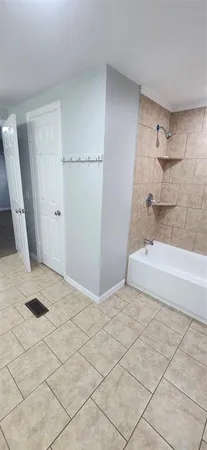 a bathroom with a sink and a shower
