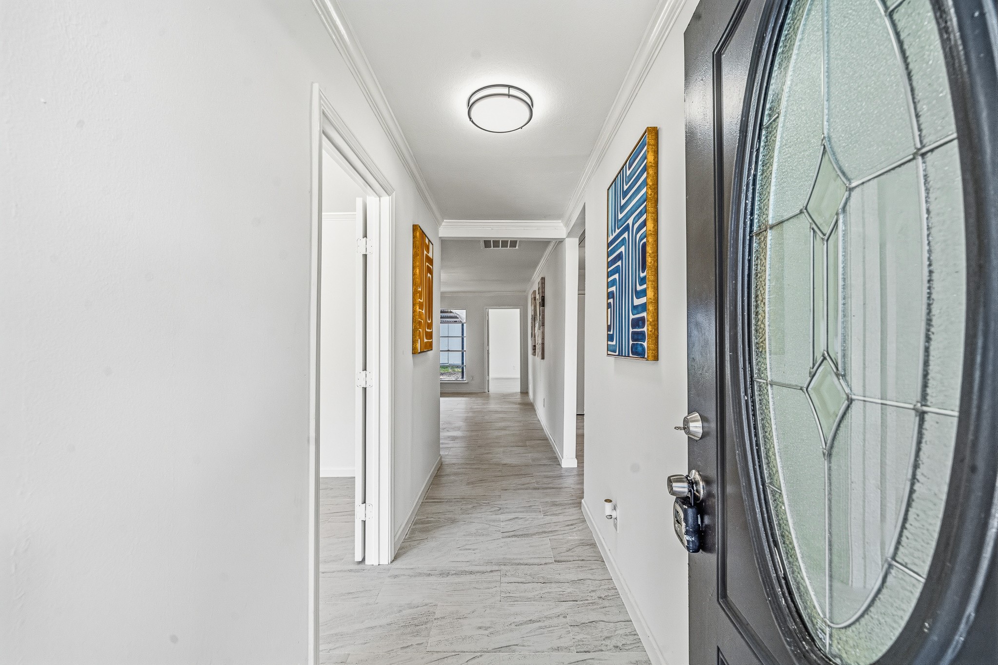 111 Princess Drive Houston, TX 77034 - Photo 5 of 30 a view of a hallway with wooden floor and door
