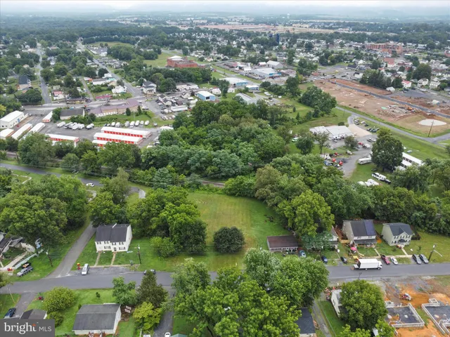 an aerial view of lake residential houses with outdoor space and swimming pool
