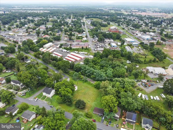 an aerial view of residential houses with city view