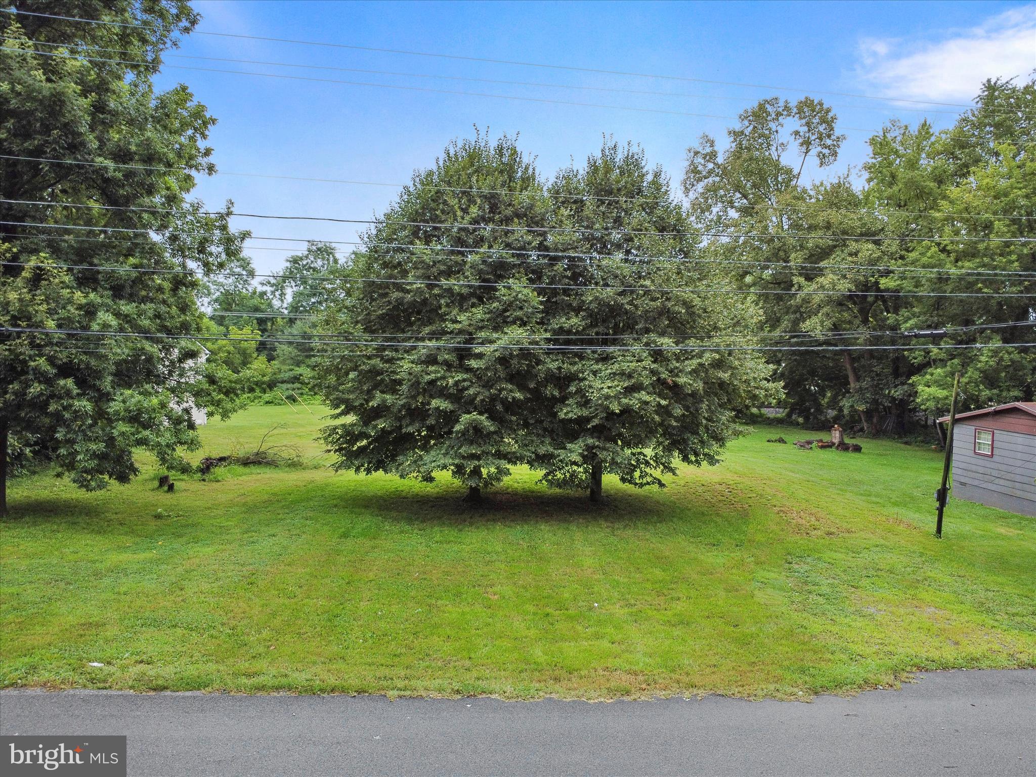 406 Burns Street Ranson, WV 25438 - Photo 23 of 32 a view of a lake from a yard
