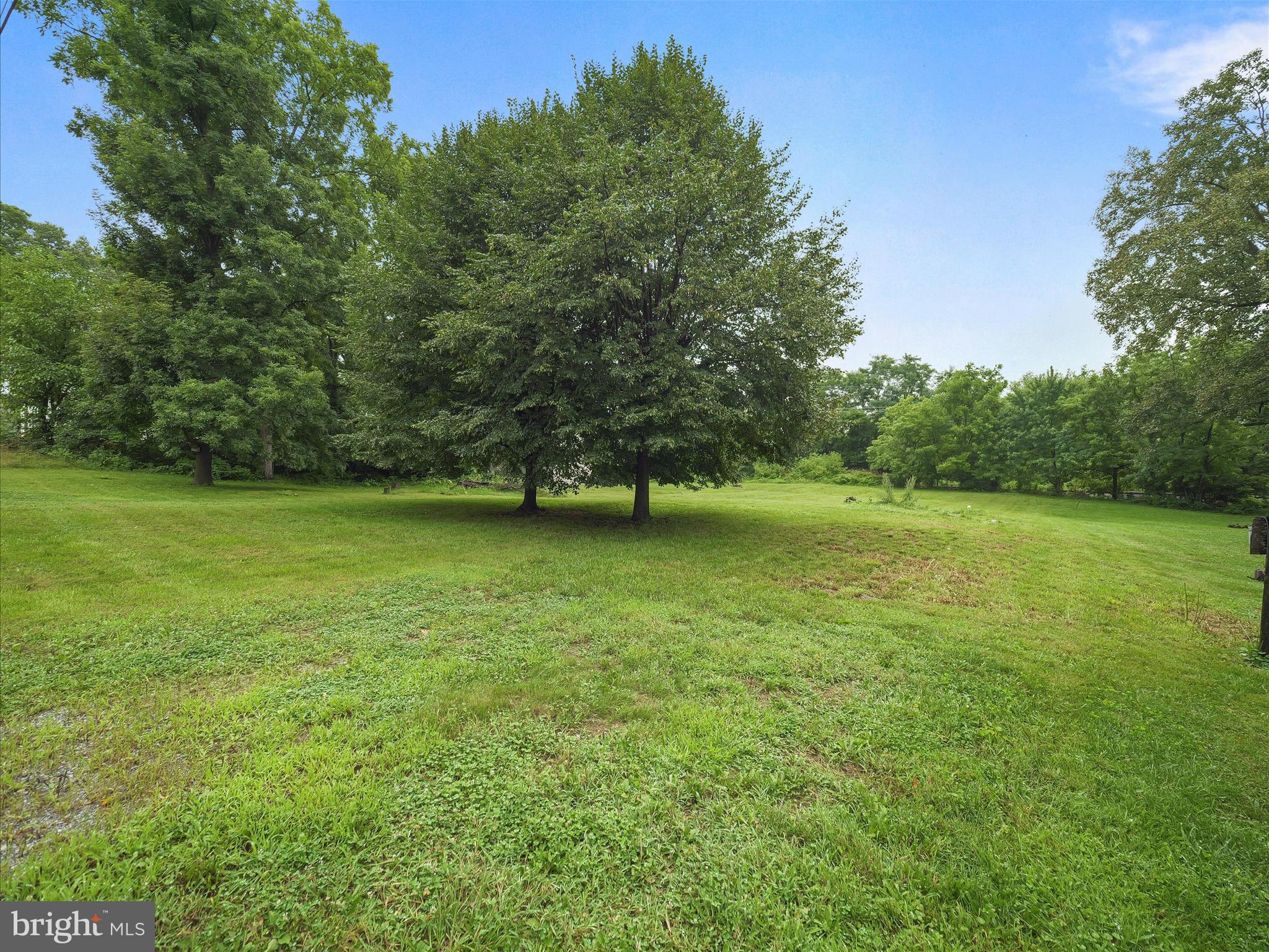 406 Burns Street Ranson, WV 25438 - Photo 27 of 32 a view of a green field with wooden fence